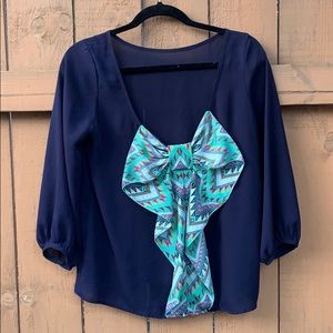 navy balloon sleeve blouse with back bow detail